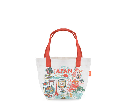A white canvas tote bag with red handles and a colorful 'JAPAN' graphic print on the front, set against a plain white background.