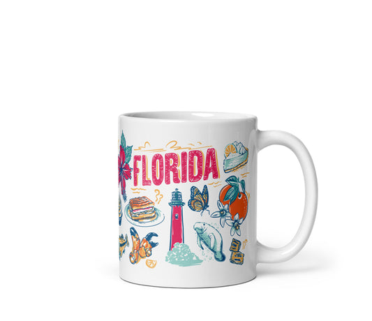 White mug with colorful Florida-themed illustrations on a white background