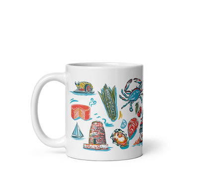 White mug with colorful illustrations of a lighthouse, sailboat, corn on the cob, crab, and other items on a white background