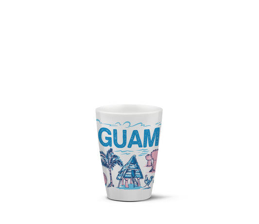 A white ceramic shot glass featuring a colorful graphic of 'GUAM' with blue text, palm trees, a beach hut, and pink and blue illustrations, set against a plain white background.